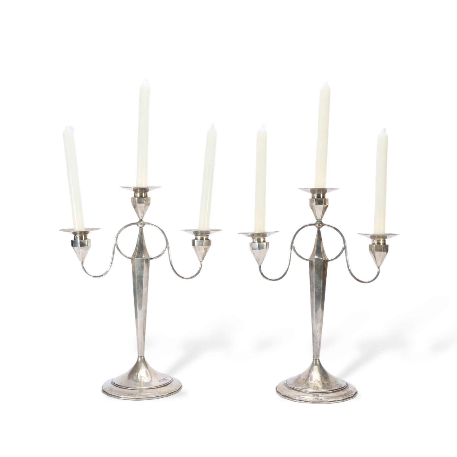 A pair of silver candlesticks: 39cm tall