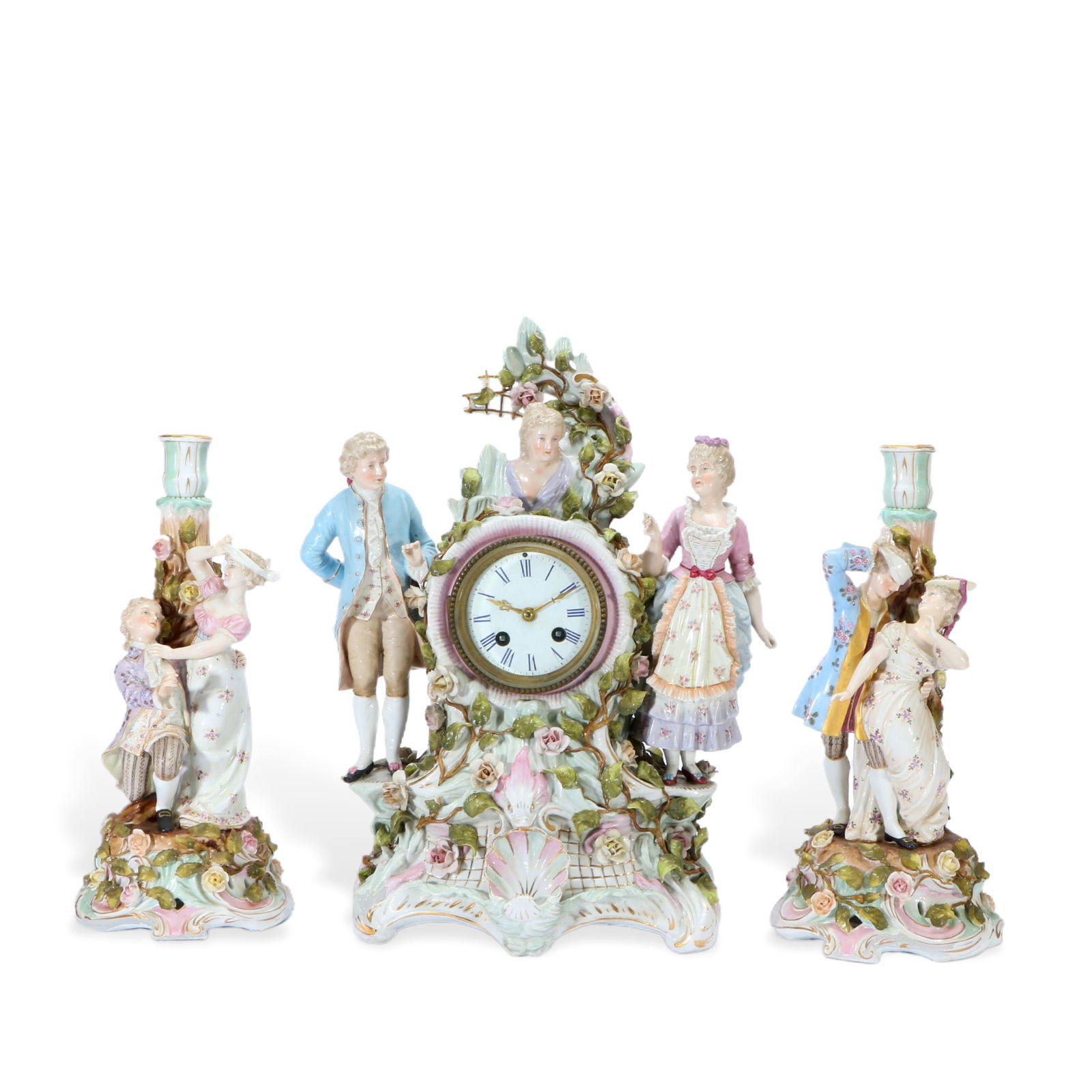 A set of porcelain clocks and candlesticks: Clock height 42cm, width 30cm, candlestick height 34cm