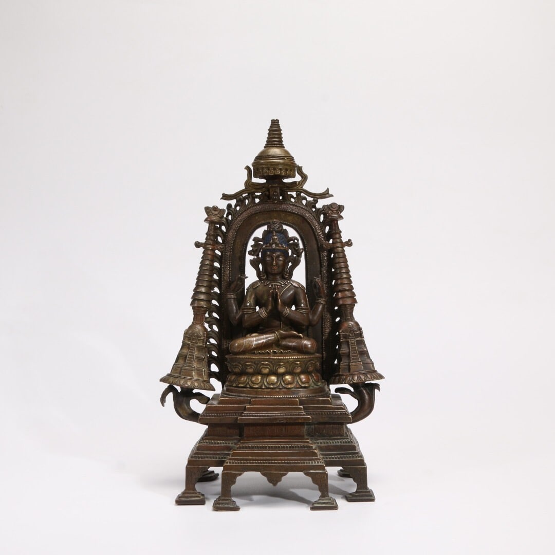 A bronze-alloy Buddha statue inlaid with silver and red copper (1 of 1)