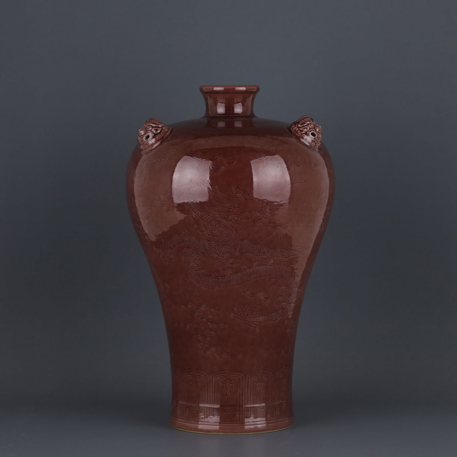 Kangxi-era brown-glazed plum vase with animal-shaped handles: 33.6*6*20.6