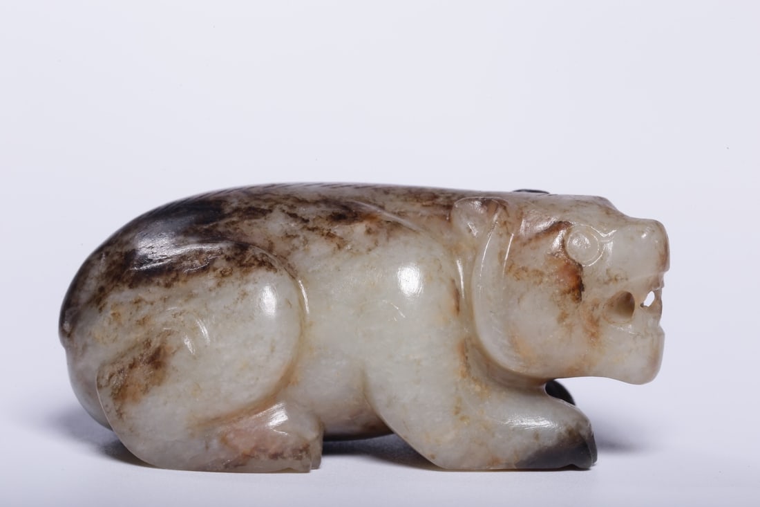 Hetian jade seed material carving with skin (1 of 4)