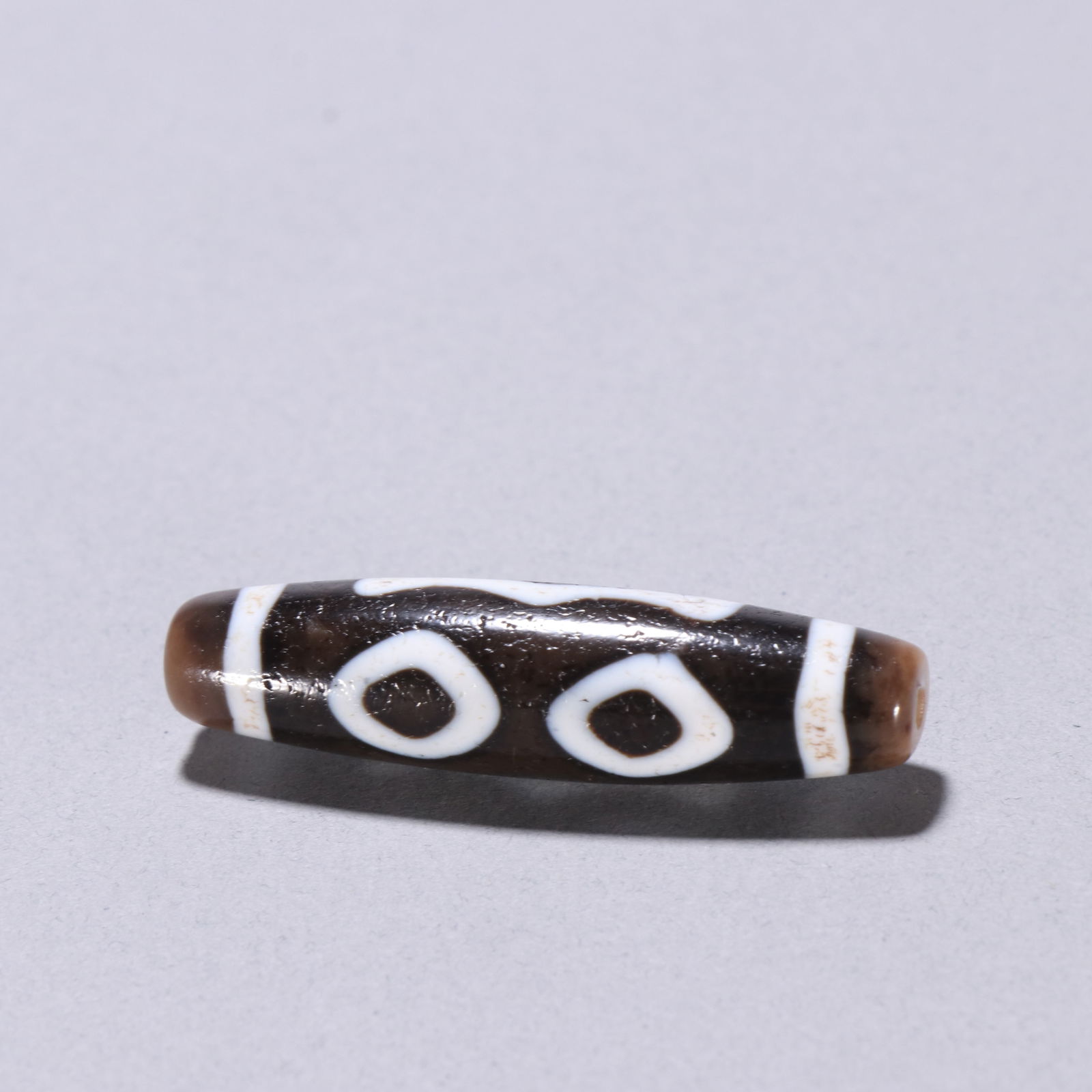 Qing Dynasty three-eyed dzi bead (1 of 4)