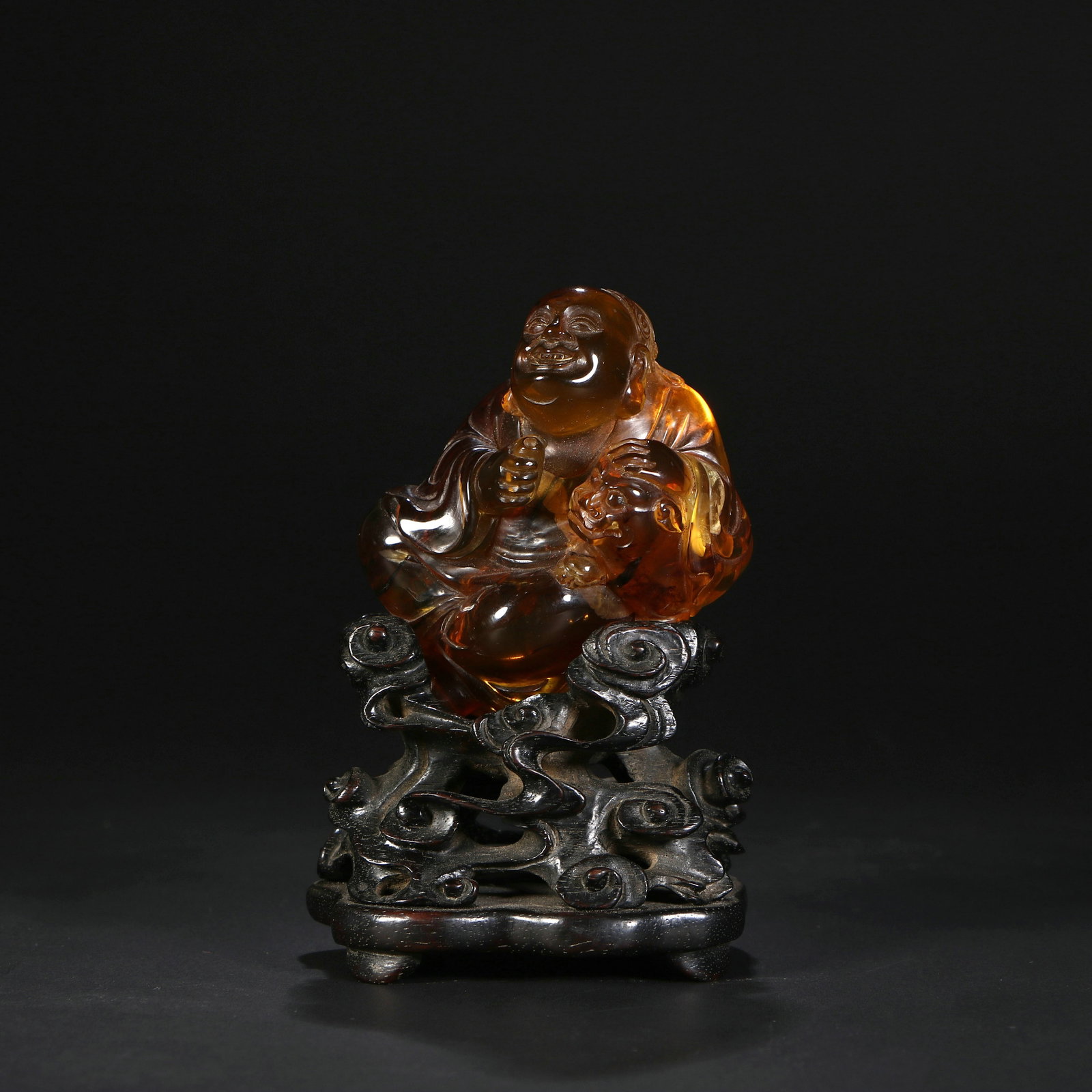 Chinese Amber figurine: With stand, height is 10cm; net height is 6.5cm; width is 5.5cm.
