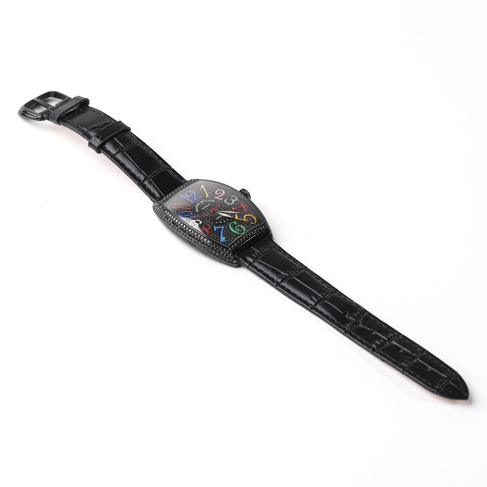 FRANCK MULLER COLOR DREAMS BLACK DIAMOND WATCH: This Franck Muller Color Dreams watch features a tonneau-shaped case with a black diamond-set bezel, enhancing its bold and distinctive design. The black dial is adorned with vibrant multi-colored num