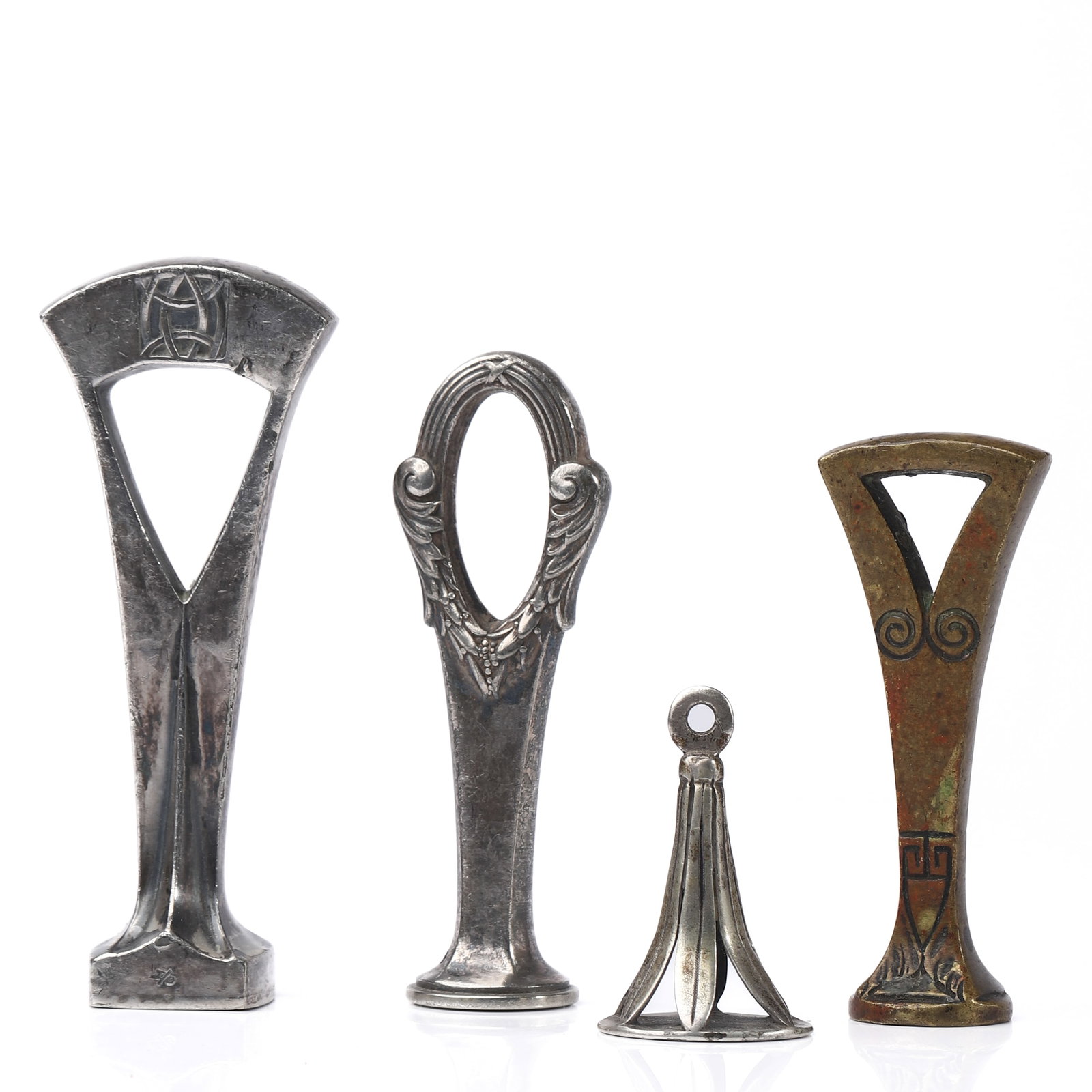 A SET OF FOUR ART NOUVEAU AND EARLY 20TH CENTURY WAX SEAL STAMPS: Dimensions tallest 3 11/32 in (8.5 cm); smallest 1 3/16 in (3 cm); total weight approx. 179.5 g Description This assembled group of four wax seal stamps showcases elegant Art Nouveau and early 20th-ce