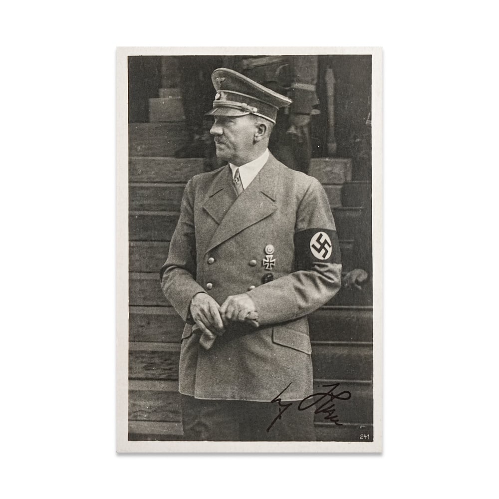 ADOLF HITLER SIGNED PHOTOGRAPHIC POSTCARD (THIRD REICH PRESS PHOTO TYPE): 5 1/2 x 3 1/2 in (14 x 9 cm) Provenance and Authentication: This collectible has undergone a rigorous forensic evaluation. The signatures were carefully analyzed across multiple criteria, including in