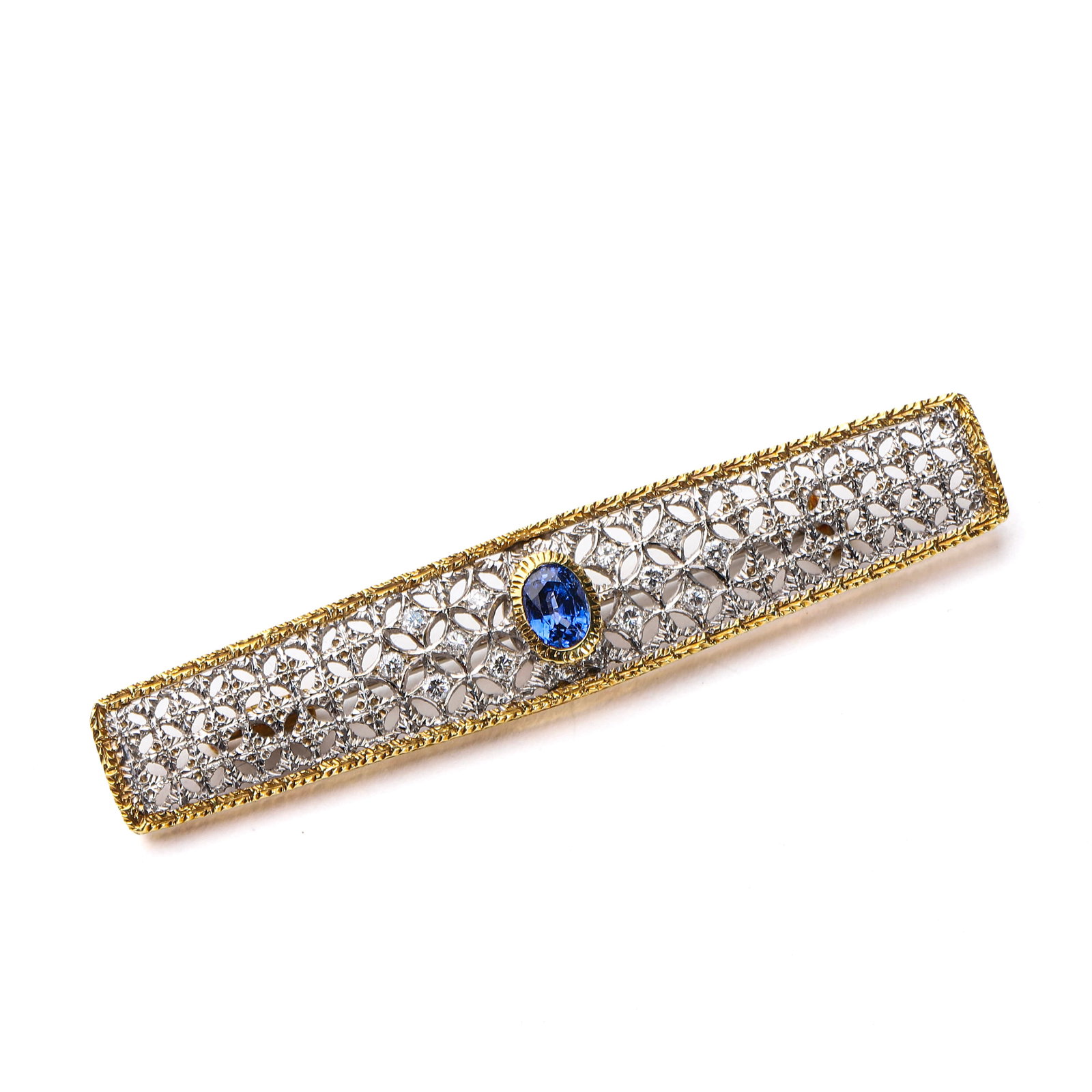 ART DECO BUCCELLATI 18K TWO-TONE GOLD, SAPPHIRE, AND DIAMOND BROOCH: Dimensions: Length: 2 5/8 in. (6.6 cm); Width: 1/2 in. (1.3 cm); Weight: 12.4 g