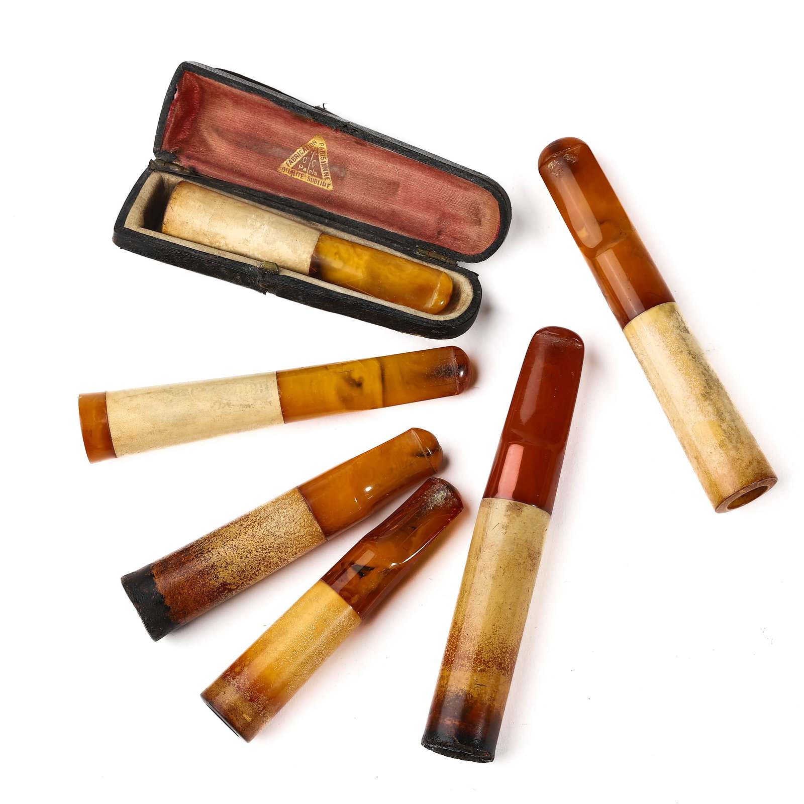 A SET OF SIX AMBER AND BONE CIGARETTE HOLDERS WITH ORIGINAL CASE (1 of 7)