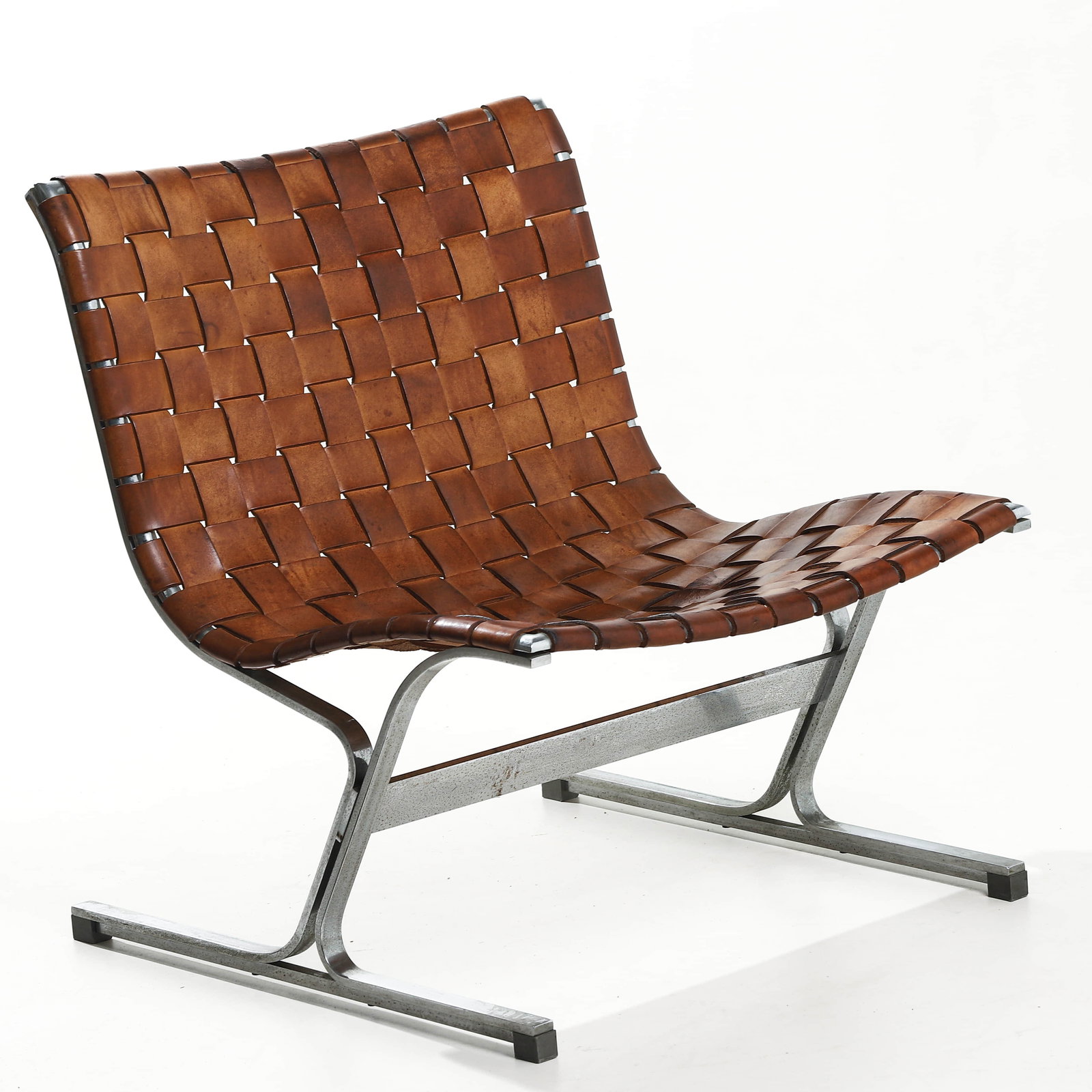 ROSS LITTELL "LUAR" WOVEN LEATHER CHAIR FOR ICF, 1965: Dimensions Height 29 1/8 in. (74 cm), Seat height 15 3/4 in. (40 cm), Width 25 5/8 in. (65 cm) Description Designed in 1965 by American designer Ross Littell for Italian manufacturer ICF, the "Luar" c