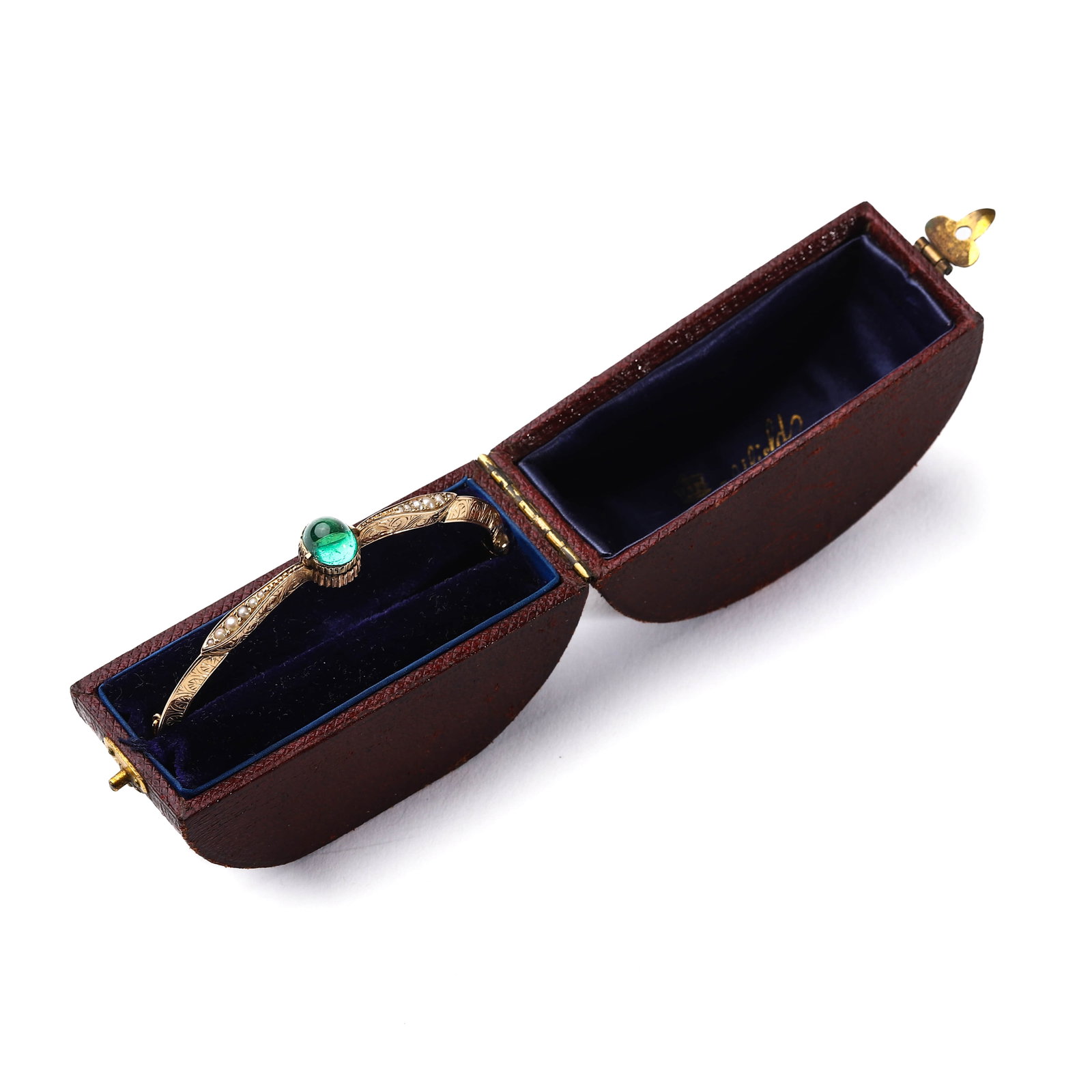 EMERALD BANGLE: This elegant bangle features a striking emerald gemstone, with a size of 7.1 × 9.3 mm (0.28 × 0.37 in.), set in a finely crafted gold band. The inner diameter of the bangle is 60 mm (2 3/8 in.), mak