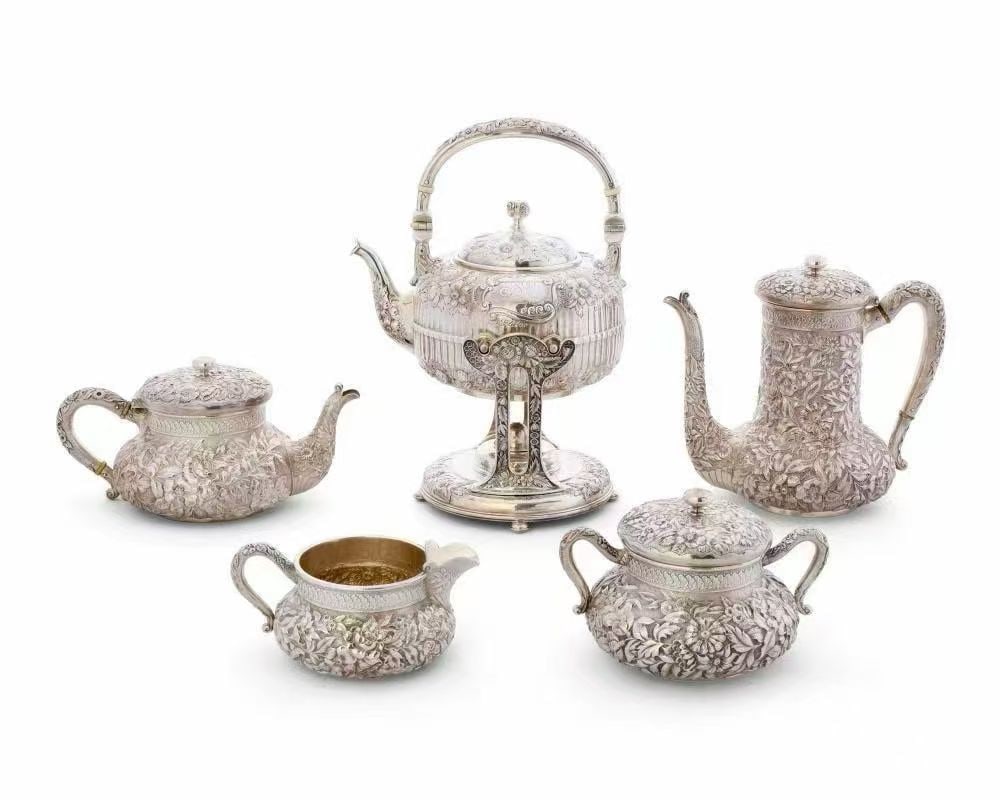 Five-piece set of ornate embossed silver coffee pots 19th century: It is 30 centimeters tall and weighs approximately 3339 grams.