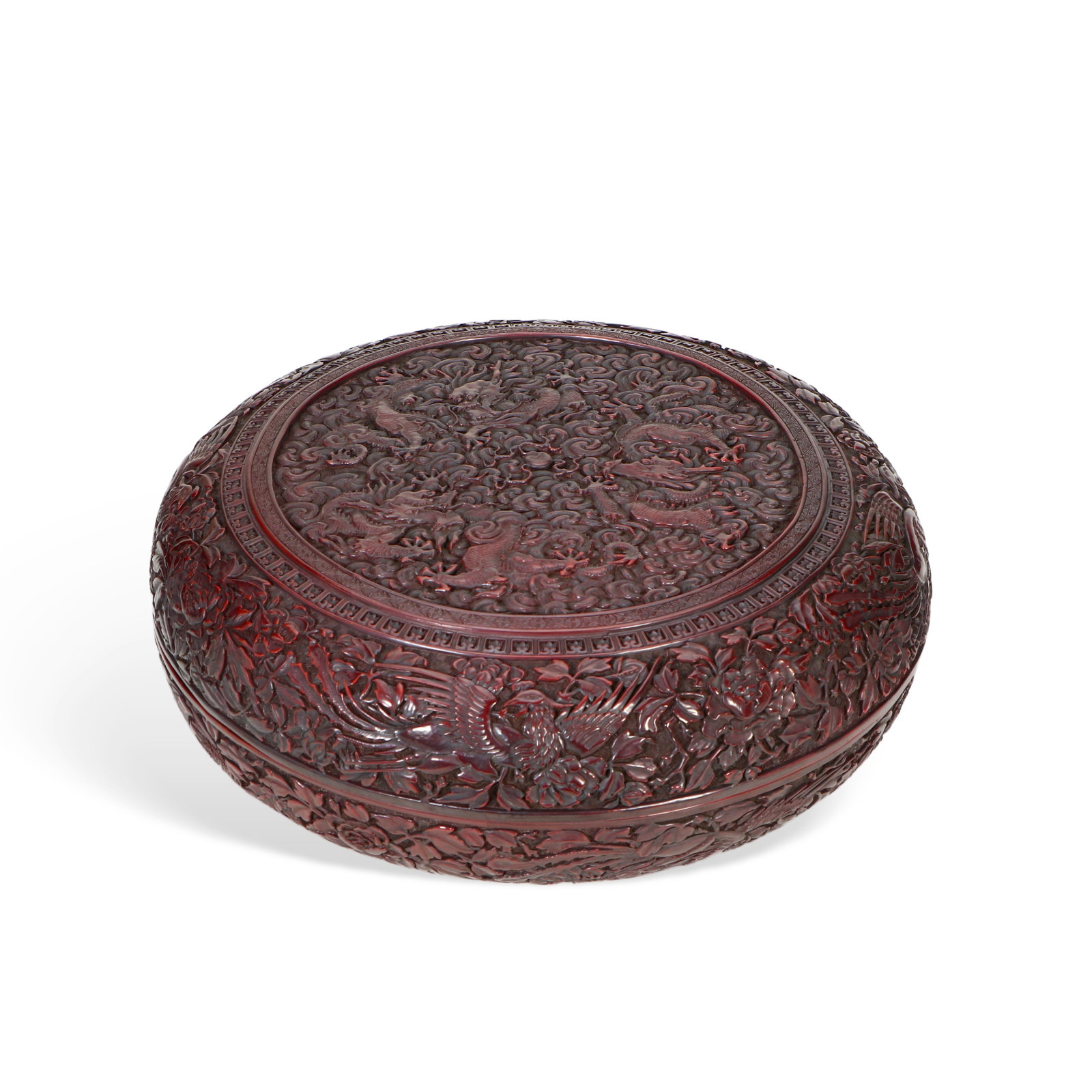 Chinese A carved red lacquer box with dragon and phoenix design Qianlong mark: Height 11cm, Diameter 30cm