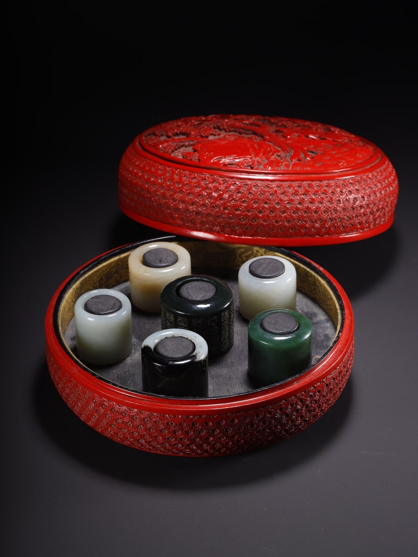 Chinese A set of carved red lacquer box thumb rings (1 of 9)