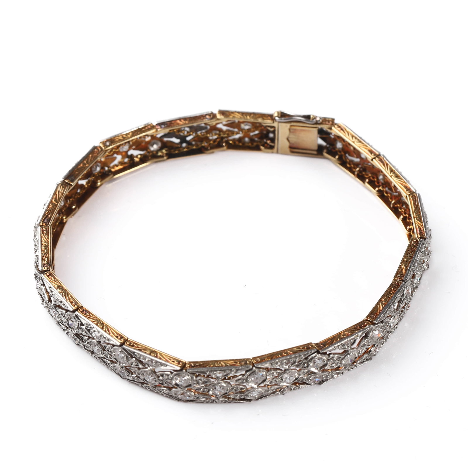 AN ANTIQUE GOLD AND DIAMOND BRACELET: Dimensions Length 7 1/2 in (19 cm); Width 5/16 in (7.7 mm); Weight 17.8 g Description Presented in its original velvet case marked Peter Delgyer, Jeweler & Optometrist, Plainfield, N.J., this finely