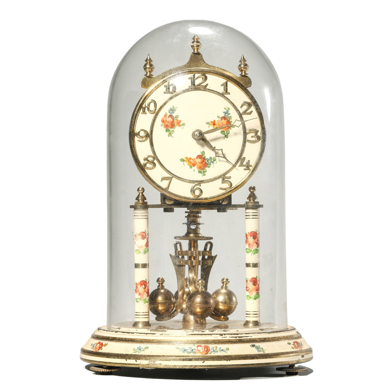 A KUNDO 400-DAY ANNIVERSARY CLOCK UNDER GLASS DOME.: Height: 8 5/8 in. (22 cm). A vintage Kundo (Kieninger & Obergfell) anniversary clock, made in West Germany, featuring a hand-painted floral dial and decorated columns, with four brass ball pendulums. 