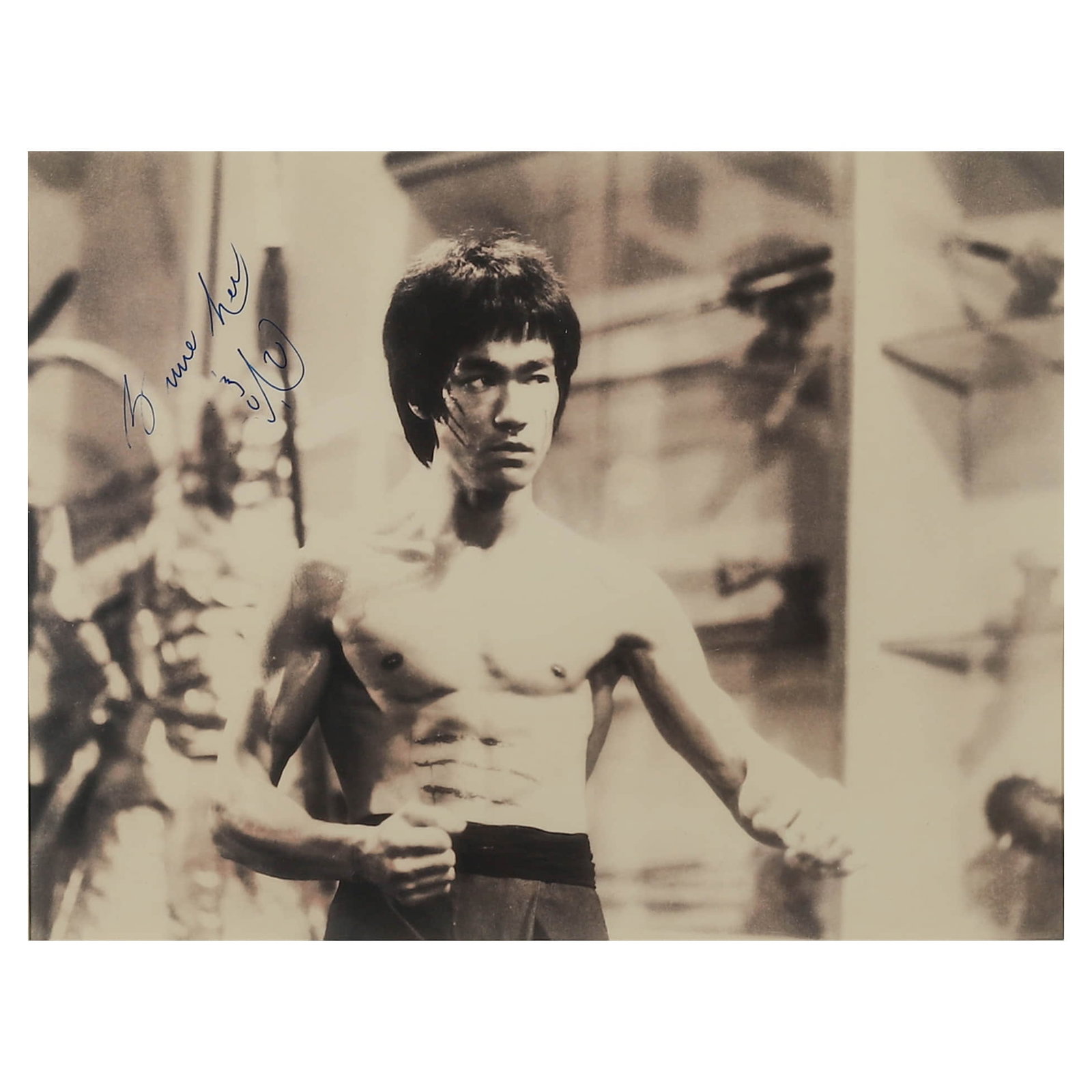 Bruce Lee Enter the Dragon (1973) Production Still: Description Title: Bruce Lee Enter the Dragon (1973) Production Still Materials: Gelatin silver print, mounted on board Signature: Signed "Bruce Lee" in blue ink on the left side of the photograph Siz