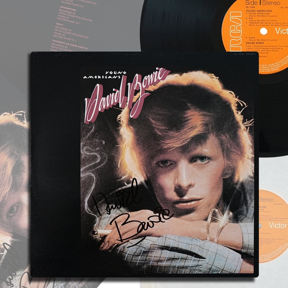 DAVID BOWIE SIGNED "YOUNG AMERICANS" LP (UK PRESSING): 12 1/4 x 12 1/4 in David Bowie stands as one of the most transformative figures in twentieth century popular music, an artist whose career was defined by constant reinvention and fearless artistic evo