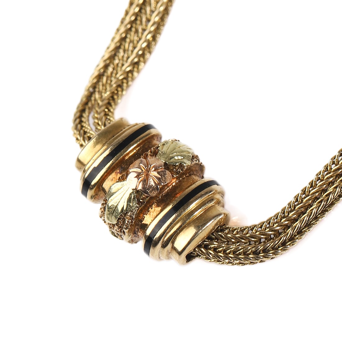 A VICTORIAN TRICOLOR GOLD SLIDE NECKLACE: Dimensions: Total Length: 15 3/4 in. (40 cm); Weight: 23.4 g Description: A finely woven double-strand chain necklace in yellow gold, centering a movable slide adorned with chased floral motifs in tri