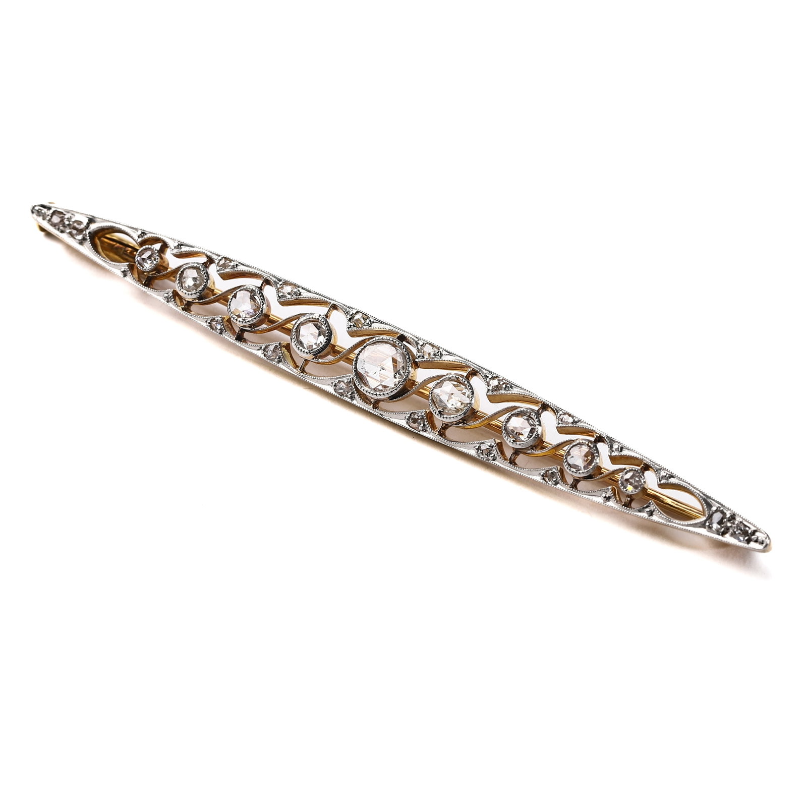A DIAMOND AND WHITE GOLD BAR BROOCH: Dimensions: Length: 8 3/8 in. (21.3 cm), Weight: 5.3 g This elegant bar brooch is crafted in white gold and features a delicate arrangement of round diamonds embedded in an intricate openwork design. 