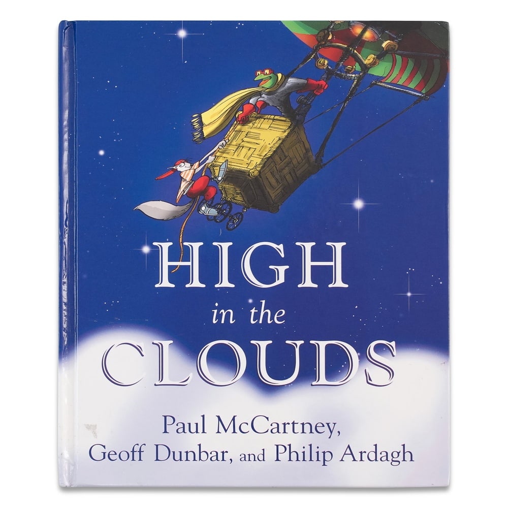 PAUL MCCARTNEY SIGNED "HIGH IN THE CLOUDS" HARDCOVER BOOK: 10 x 8 1/8 in (25.5 x 20.7 cm) Provenance and Authentication: This collectible has undergone a rigorous forensic evaluation. The signatures were carefully analyzed across multiple criteria, including 