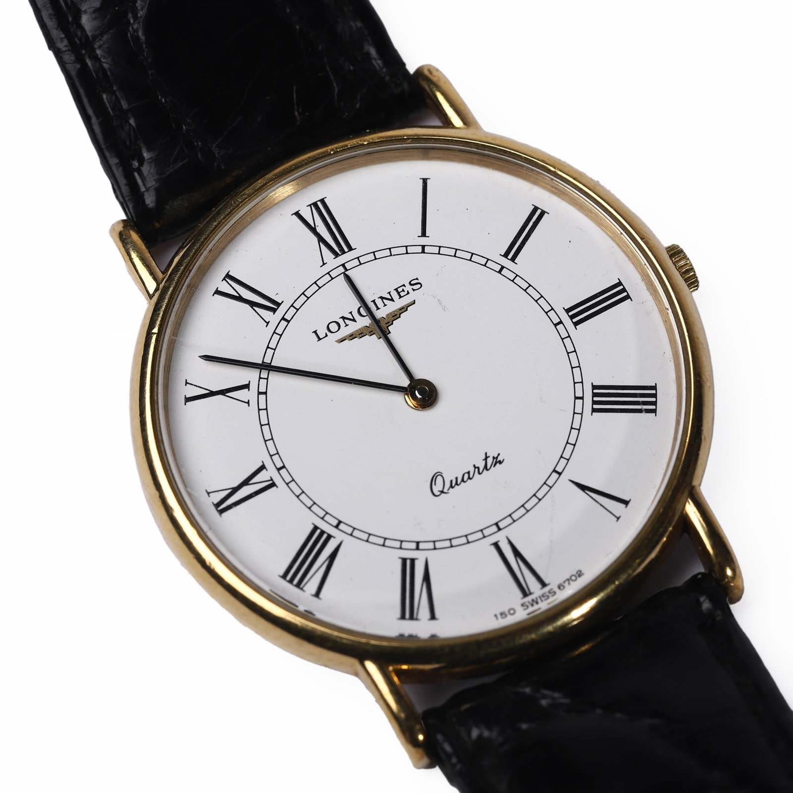 LONGINES QUARTZ WRISTWATCH WITH ROMAN NUMERALS AND LEATHER STRAP: Dimensions: Dial Diameter: 33.5 mm, Overall Length: 9 1/4 in. (23.5 cm) This elegant Longines wristwatch features a gold-tone round case with Roman numeral hour markers and classic black hands. The di