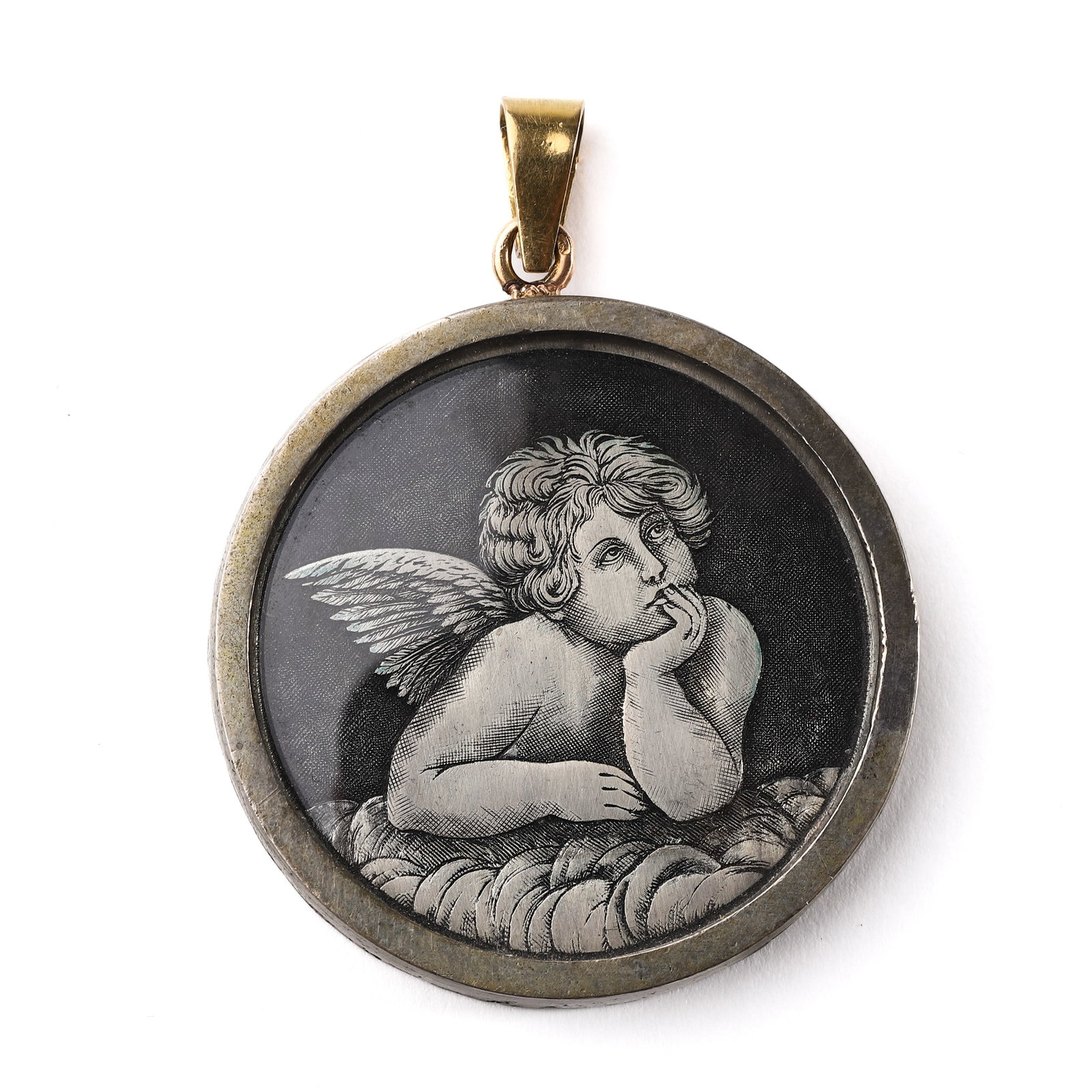 A FRENCH ENGRAVED GLASS PORTRAIT PENDANT DEPICTING A PUTTO, EARLY 20TH CENTURY: Dimensions: Diameter: 1 5/8 in. (41.1 mm); Weight: 25.7 g Description: This circular pendant features a finely engraved depiction of a cherubic putto resting thoughtfully on clouds, rendered with intr