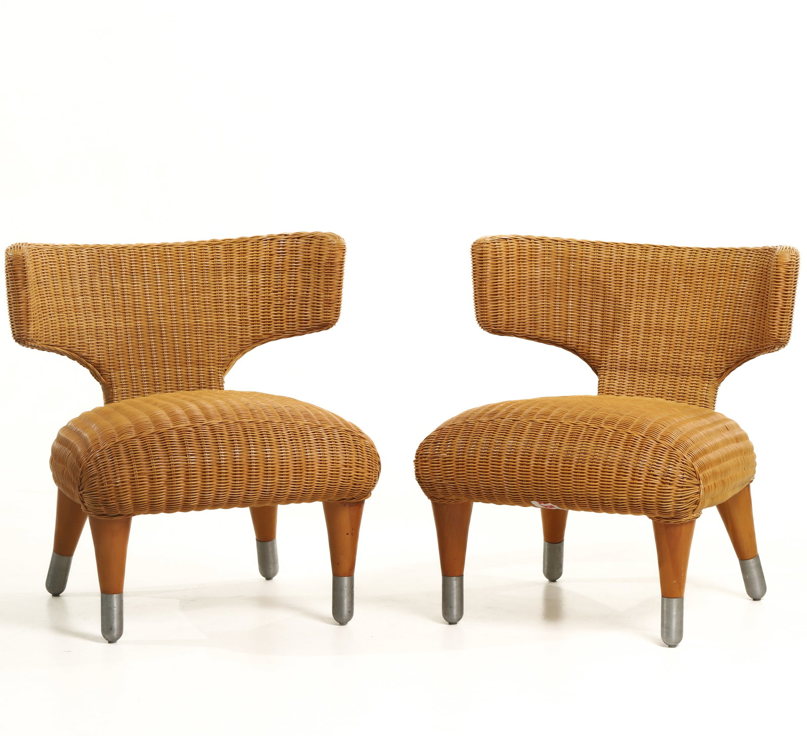 RATTAN LOUNGE CHAIRS BY ANTONIO CITTERIO (B&B ITALIA, 1990s): Dimensions (Each) Height: 28 in. (71 cm); Width: 26 3/8 in. (67 cm) Description A stylish pair of lounge chairs designed by Antonio Citterio and produced by B&B Italia, Italy, in the 1990s. Featuring 