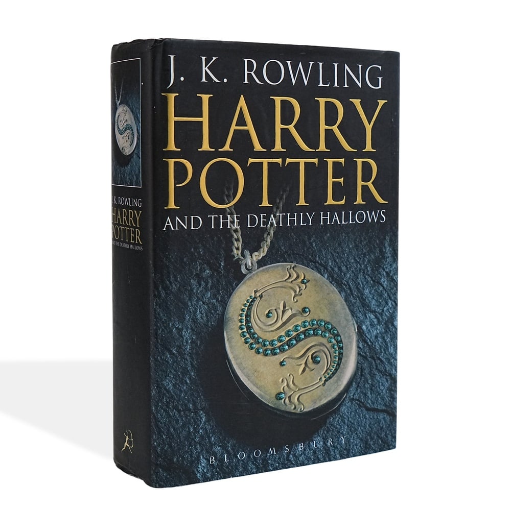 J. K. ROWLING SIGNED HARRY POTTER AND THE DEATHLY HALLOWS FIRST EDITION: 9 1/4 x 6 1/4 in (23.5 x 16 cm) Harry Potter and the Deathly Hallows is the seventh and concluding installment of J. K. Rowling's legendary Harry Potter series, bringing one of the most influential li