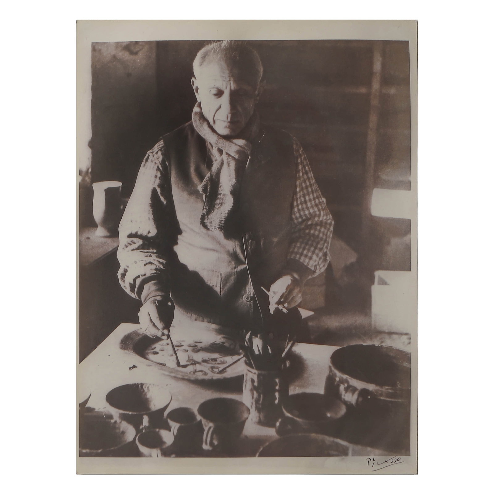 SIGNED PHOTOGRAPH OF PICASSO: Title: SIGNED PHOTOGRAPH OF PICASSO Material: Gelatin silver print, mounted on board Signature: Signed "Picasso" in black ink, lower right Dimensions Photograph 7 15/16 × 9 15/16 in. (20.1 × 25.2 cm