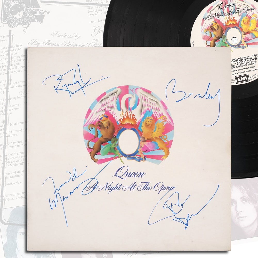 QUEEN FULLY SIGNED "A NIGHT AT THE OPERA" LP: 12 1/4 x 12 1/4 in Provenance and Authentication: According to the Letter of Authenticity (LOA) and Certificate of Authenticity (COA) provided by the consignor, this collectible was subjected to a for