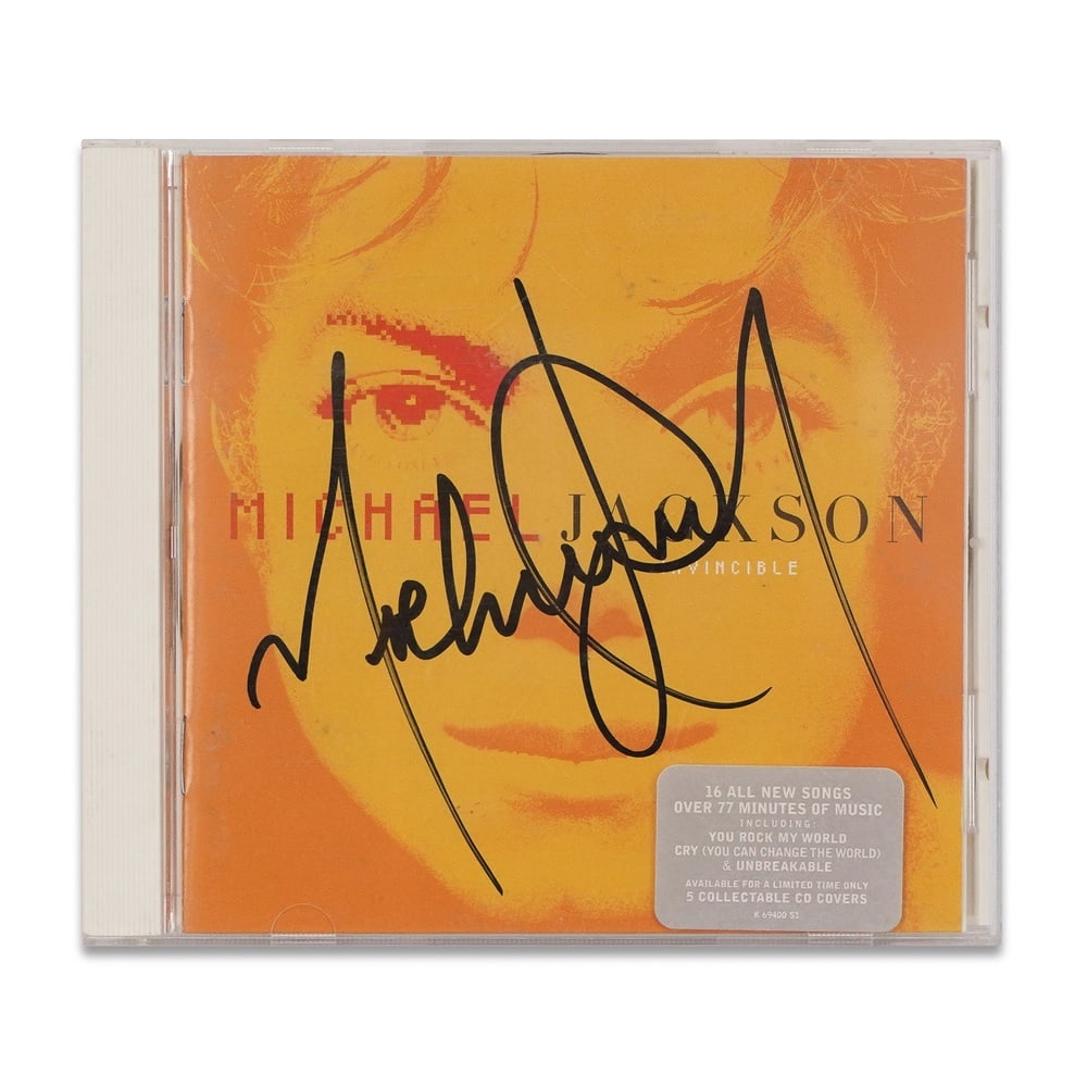 MICHAEL JACKSON SIGNED "INVINCIBLE" CD: 5 5/8 x 4 7/8 in (14.2 x 12.4 cm) Provenance and Authentication: According to the Letter of Authenticity (LOA) and Certificate of Authenticity (COA) provided by the consignor, this collectible was sub