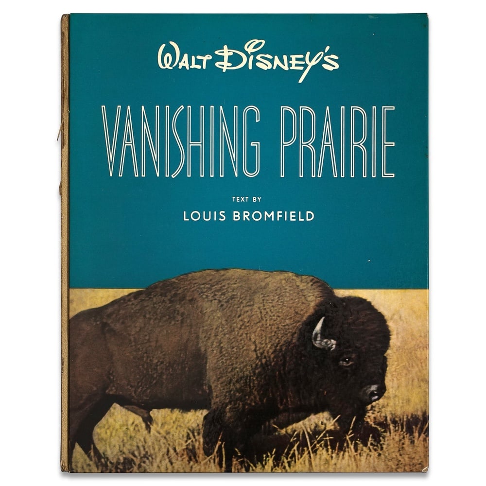 WALT DISNEY SIGNED "WALT DISNEY'S VANISHING PRAIRIE" BOOK: 9 1/4 x 11 5/8 in (23.4 x 29.5 cm) Provenance and Authentication: According to the Letter of Authenticity (LOA) and Certificate of Authenticity (COA) provided by the consignor, this collectible was su