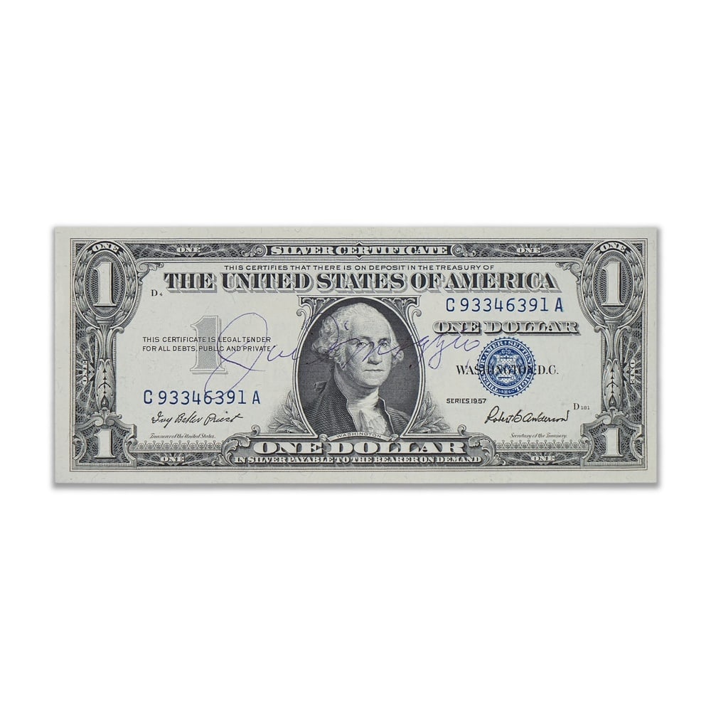 JOE DIMAGGIO SIGNED 1957 ONE DOLLAR SILVER CERTIFICATE: 6 1/8 x 2 1/2 in (15.5 x 6.5 cm) Provenance and Authentication: According to the Letter of Authenticity (LOA) and Certificate of Authenticity (COA) provided by the consignor, this collectible was