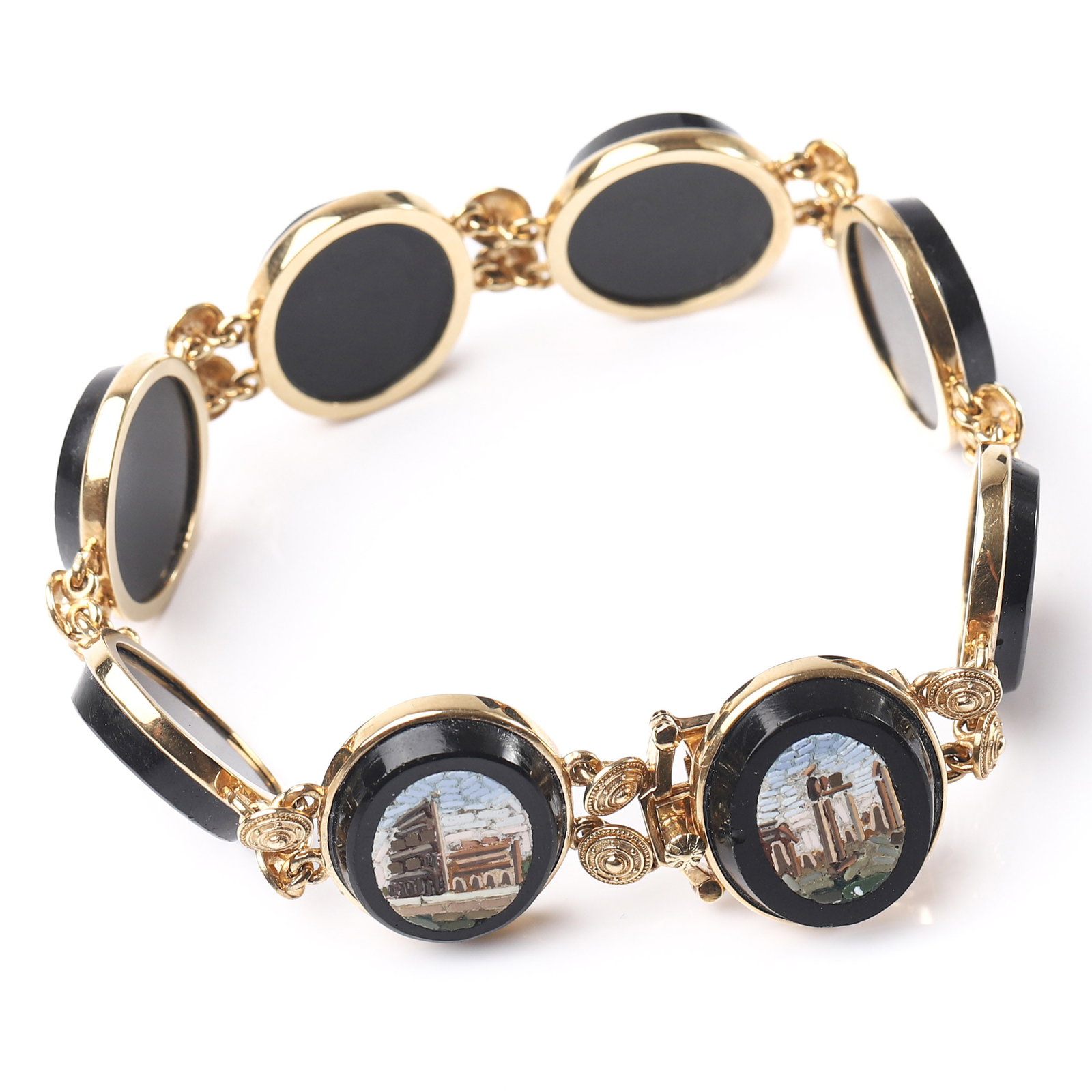 A GOLD MICROMOSAIC BRACELET DEPICTING ROMAN MONUMENTS.: Dimensions Total length 7 7/8 in (20 cm); each panel approx. 3/4 × 5/8 in (19.7 × 16.3 mm); weight 36.8 g.Description The bracelet is composed of seven oval micromosaic panels, each intricately depi