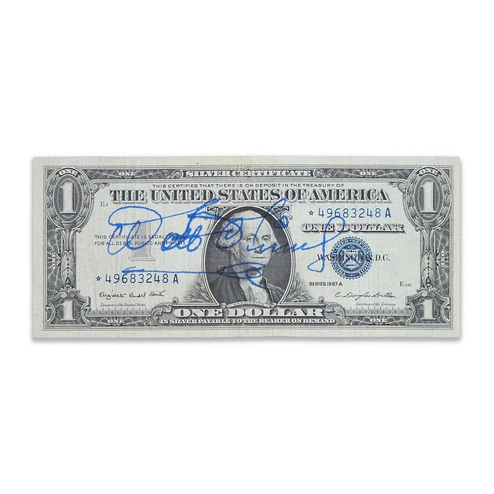 WALT DISNEY SIGNED 1957A ONE DOLLAR SILVER CERTIFICATE: 6 1/8 x 2 1/2 in (15.5 x 6.5 cm) Provenance and Authentication: According to the Letter of Authenticity (LOA) and Certificate of Authenticity (COA) provided by the consignor, this collectible was subj