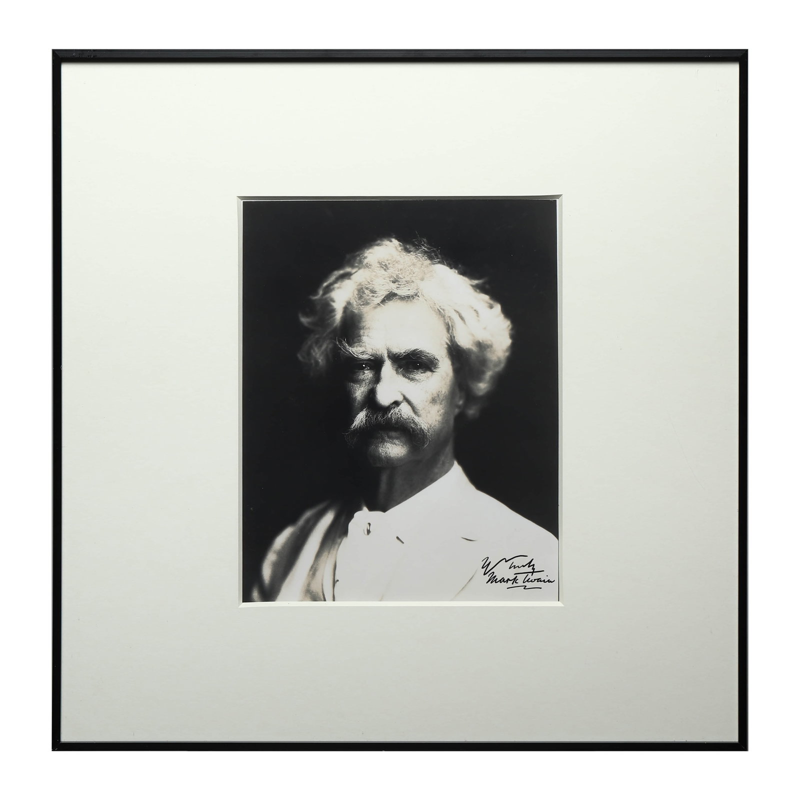 MARK TWAIN PORTRAIT PHOTOGRAPH: Title MARK TWAIN PORTRAIT PHOTOGRAPH Material Gelatin silver print, mounted on board Signature Signed in black ink by Mark Twain at the lower right Dimensions Photograph 9 1/16 × 11 7/16 in. (23 × 2