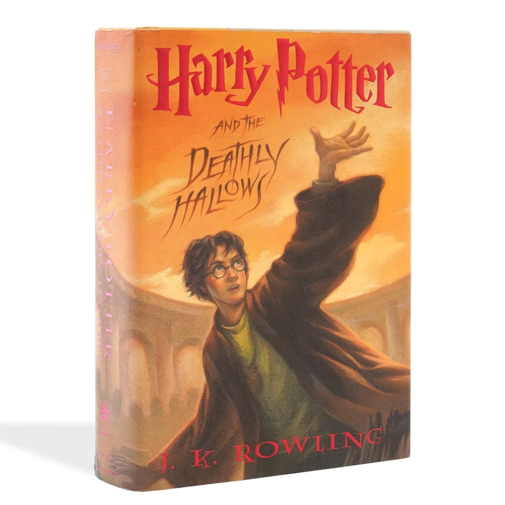 J.K. ROWLING SIGNED HARRY POTTER AND THE DEATHLY HALLOWS: 9 1/4 x 6 1/4 in (23.5 x 16 cm) J.K. Rowling's Harry Potter series stands as one of the most influential literary phenomena of modern publishing history. Since the release of the first novel in the