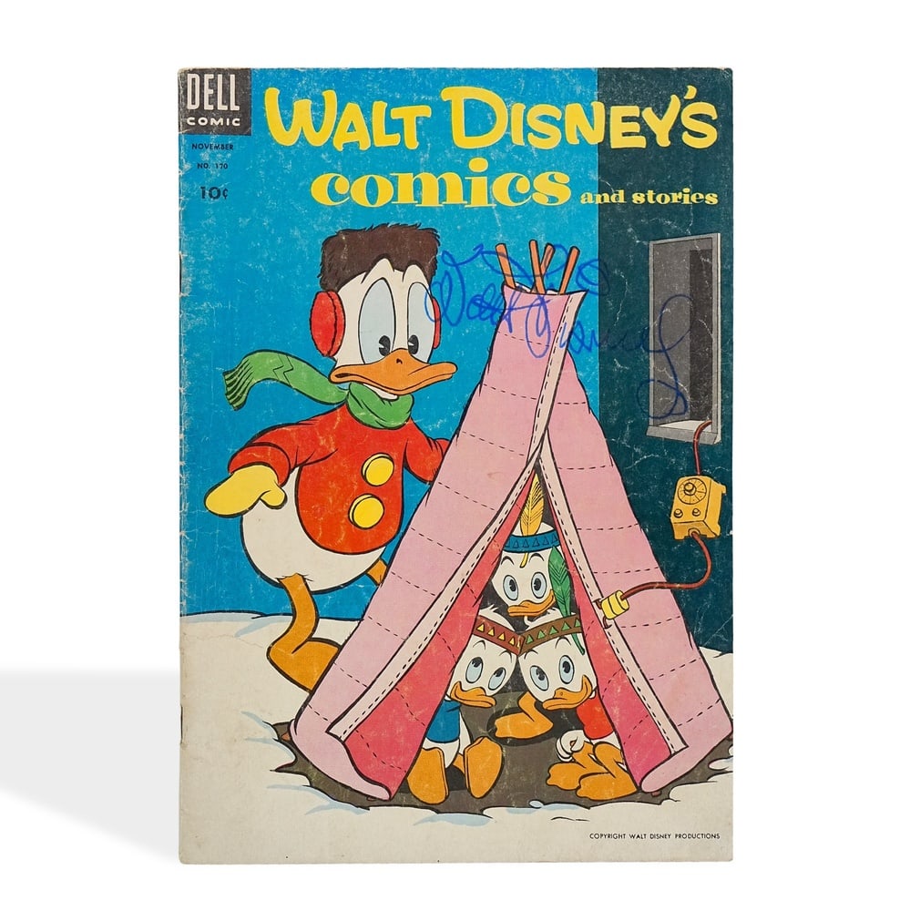 WALT DISNEY SIGNED WALT DISNEY'S COMICS AND STORIES: 10 1/4 x 7 1/8 in (26 x 18.2 cm) Provenance and Authentication: According to the Letter of Authenticity (LOA) and Certificate of Authenticity (COA) provided by the consignor, this collectible was