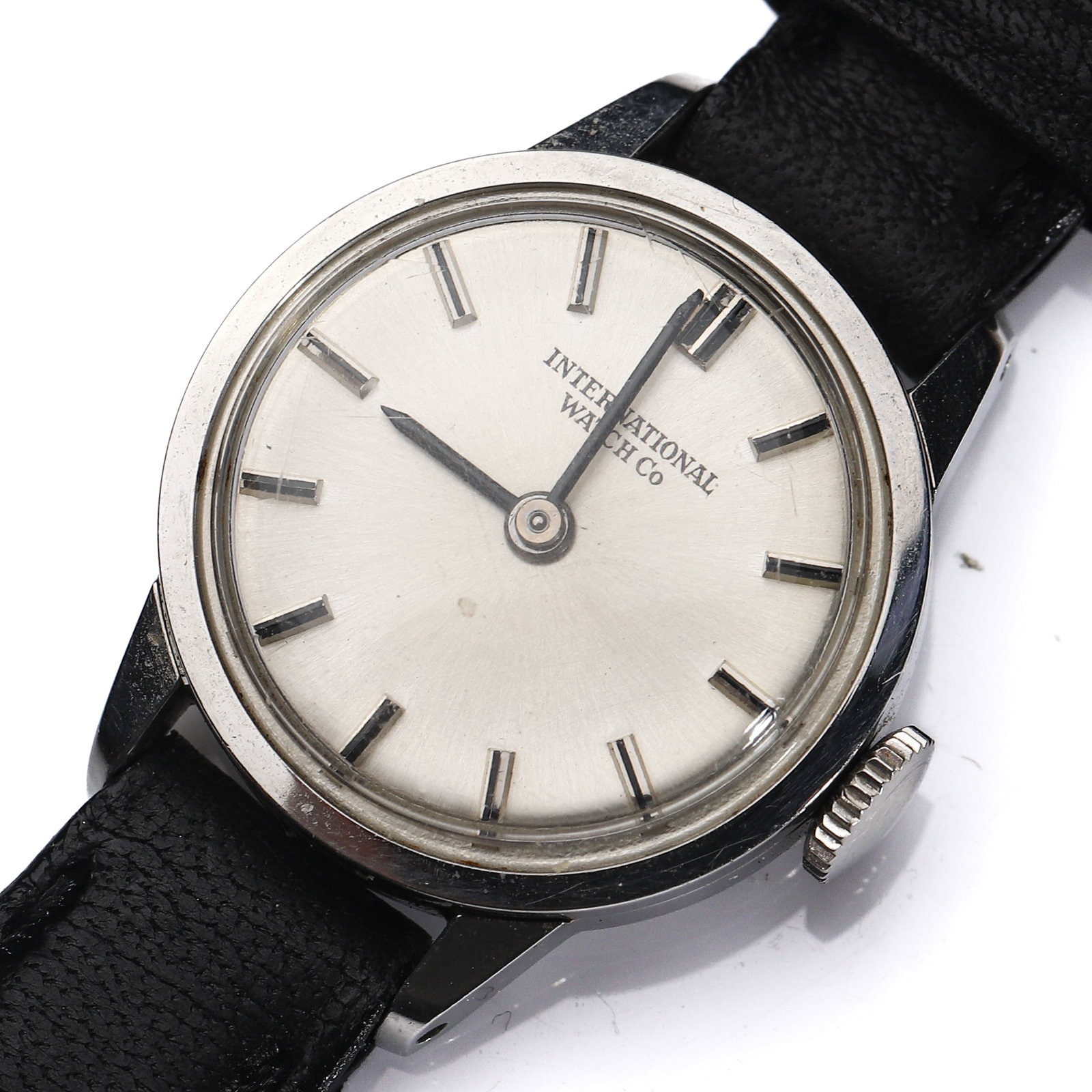 INTERNATIONAL WATCH CO. (IWC) STAINLESS STEEL MANUAL-WIND WRISTWATCH: Dimensions Case diameter approx. 13/16 in (21 mm); overall length approx. 7 7/8 in (20 cm). Description An elegant vintage wristwatch by International Watch Co. (IWC), featuring a polished stainless s