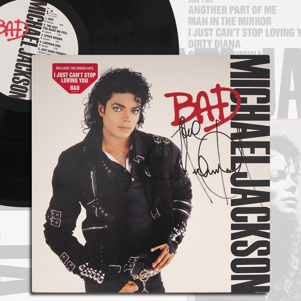 MICHAEL JACKSON SIGNED "BAD" LP: 12 3/8 x 12 3/8 in (31.5 x 31.5 cm) Provenance and Authentication: According to the Letter of Authenticity (LOA) and Certificate of Authenticity (COA) provided by the consignor, this collectible was