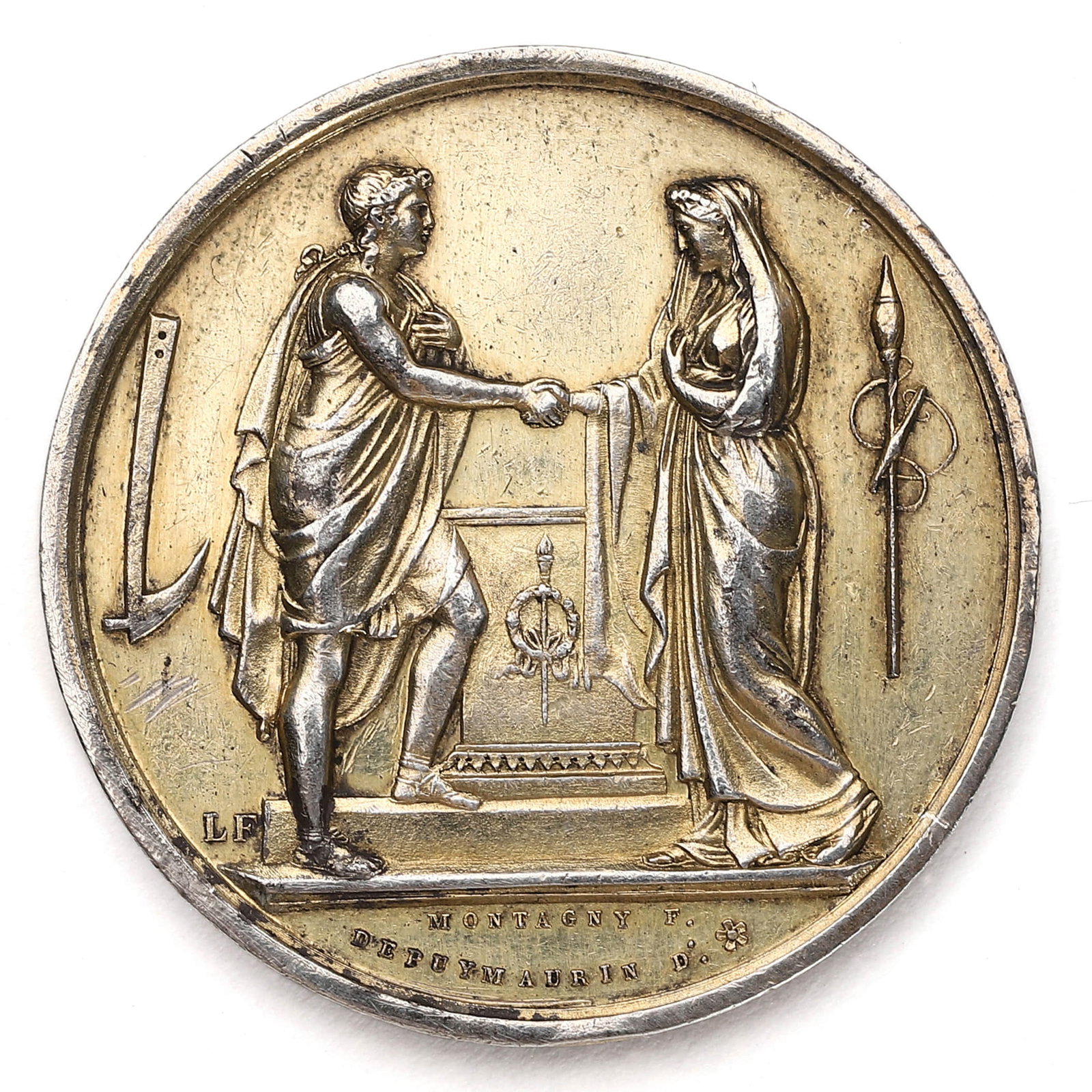 FRENCH SILVER MEDAL OF MARRIAGE OR CIVIC UNION, DATED 1831: Dimensions: Diameter: 1 3/8 in. (35 mm); Weight: 17.5 g Description: A finely struck French silver medal featuring a classical neoclassical scene on the obverse, where a robed male and female figure