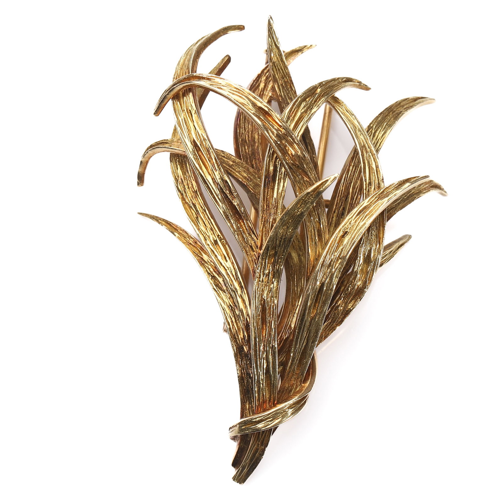 A GOLD BROOCH BY MELLERIO DITS MELLER, PARIS: Dimensions Length: 2 3/16 in (56 mm); Width: 1 1/2 in (37.5 mm); Weight: 23 g. Description: A finely modeled 18K yellow gold brooch designed as a stylized bouquet of elongated leaves, intricately text