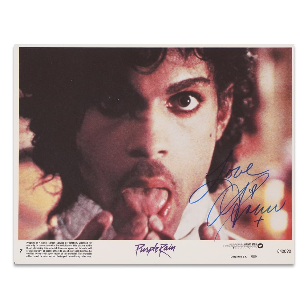 PRINCE SIGNED "PURPLE RAIN" 1984 LOBBY CARD: 10 x 8 in (25.5 x 20.4 cm) Provenance and Authentication: According to the Letter of Authenticity (LOA) and Certificate of Authenticity (COA) provided by the consignor, this collectible was subjected 