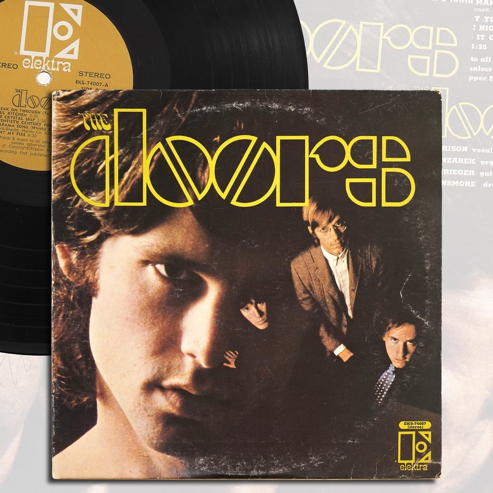 THE DOORS FULLY SIGNED "THE DOORS" LP: 12 1/4 x 12 1/4 in Provenance and Authentication: According to the Letter of Authenticity (LOA) and Certificate of Authenticity (COA) provided by the consignor, this collectible was subjected to a