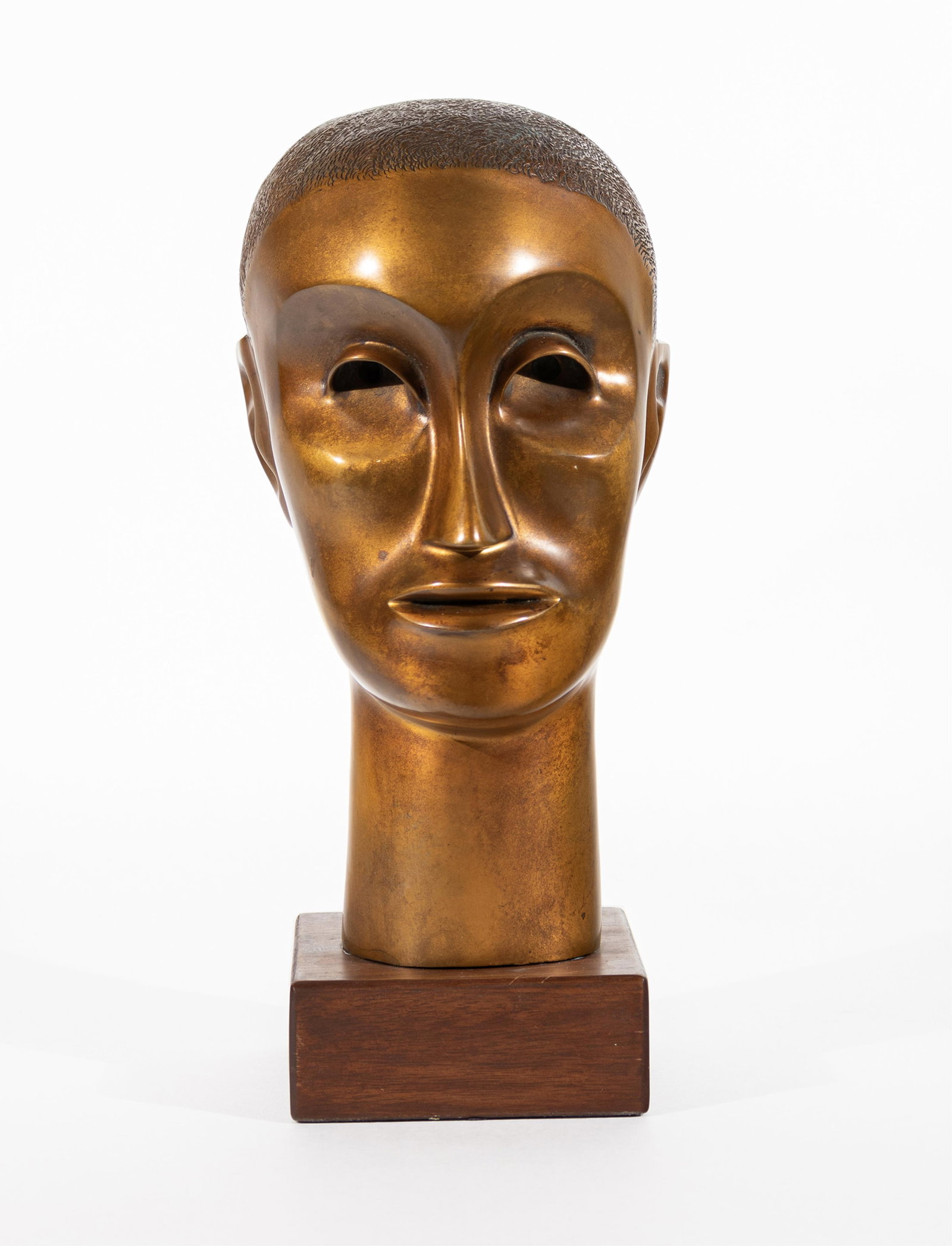Elizabeth Catlett, 1915-2012, Head of a Man: Elizabeth Catlett 1915-2012 Head of a Man 1972 bronze with gold/brass patina 12 inches high (bronze only) on wood base 2 x 5 x 5 inches initialed Provenance: acquired directly from the artist, pri