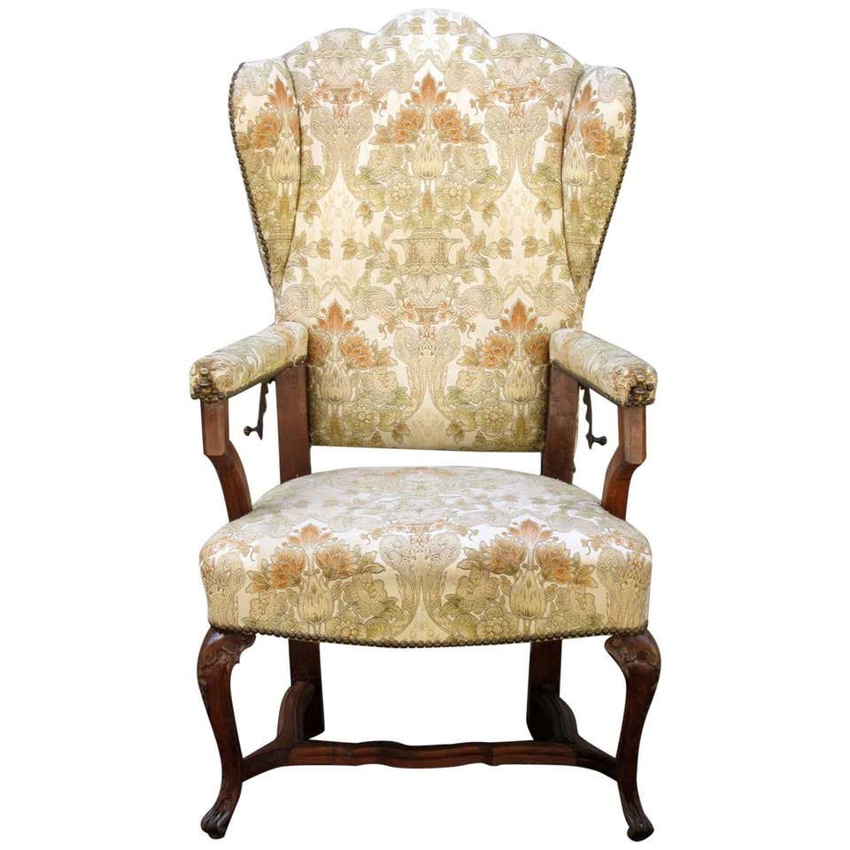18th C French Provincial Reclining Wingback: A late 18th century French Provincial reclining upholstered wingback chair with steel extenders.