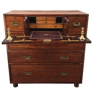 Regency Brass Mounted Secrétaire Campaign Chest: This mid-19th century brass-mounted mahogany two-part Campaign chest has a removable mahogany panel covering the satinwood. Fitted interior of the secrétaire drawer with usual folding sides.