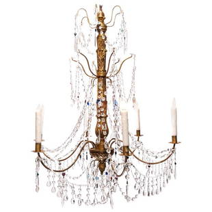 Late 19th Century Italian Genoese Giltwood Chandelier: A grand scale Italian Genovese carved giltwood, crystal and tole chandelier, circa 1890, featuring colored crystals. Six-arm chandelier with crystal swag and beading. The chandelier has been recently