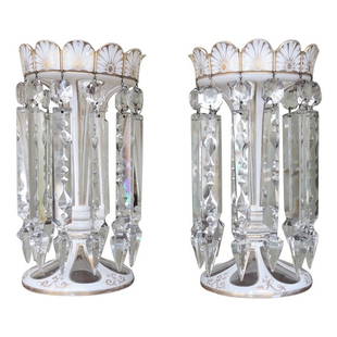 Early 19th C English Regency Crystal Lusters: This pair of lusters were made in England during the first half of the 19th century. The body is made of cut-glass with applied gilt. There are twelve long prisms that hang from the top rim.