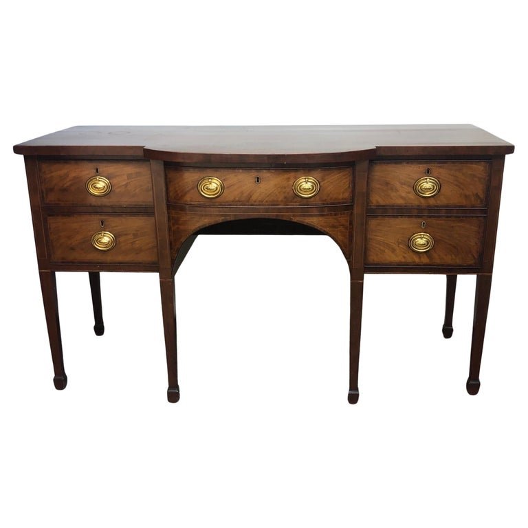 18th Century English Georgian Inlay Sideboard: 18th Century English Georgian Mahogany Inlay Sideboard with crossbanded top. Retains the original pulls. The English Georgian Sideboard has middle cutlery drawer flanked by a two drawers on the left s